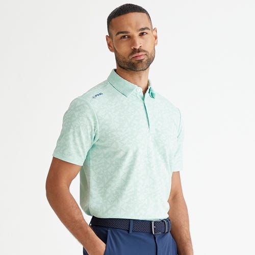 Geo camo golf polo shirt in misty green mens lifestyle front