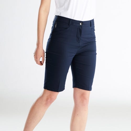margot ladies performance golf shorts in navy lifestyle side
